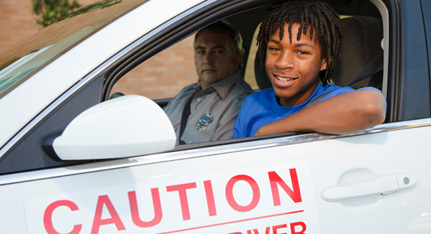 Image of a teen taking driving test