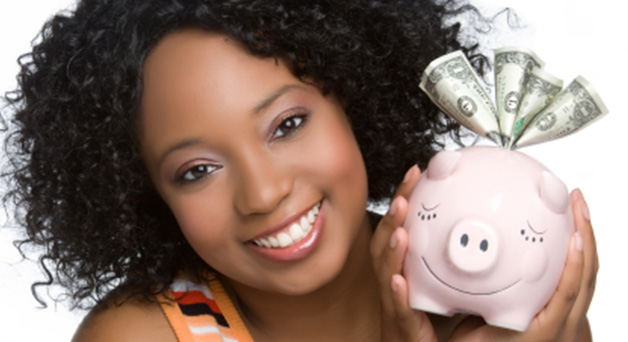 Image of a teen holding a piggy bank