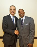 The Honorable Eric H. Holder, Jr., Attorney General of the United States, with Isaiah Thomas