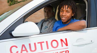 Image of a teen taking driving test