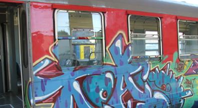Image of a city bus with graffiti 