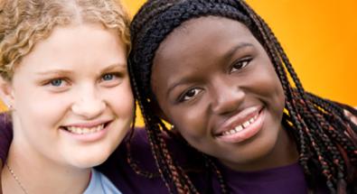 Image of two teens smiling
