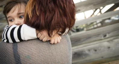 Image of a child hugging a mother